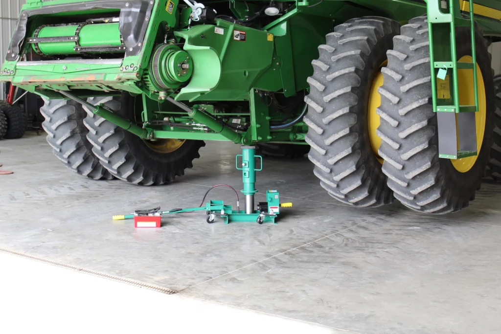 Image of a Model SC-60 Single Cylinder Farm Service Jack under combine